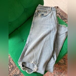 A Golde ripped medium rise light jeans with buttons and frayed ends